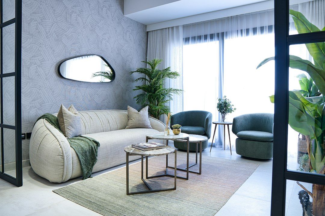 Modern living room with plush sofa and green chairs